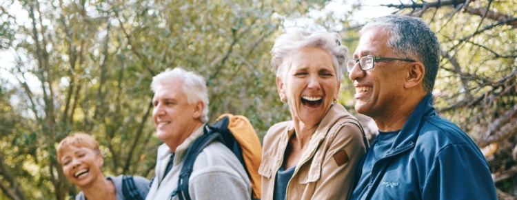 A group of friends hiking and laughing together.