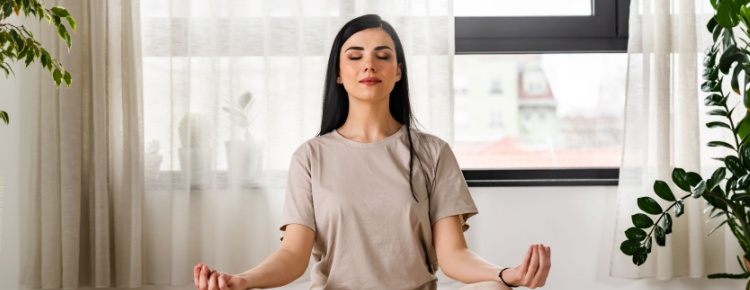 A woman meditating.