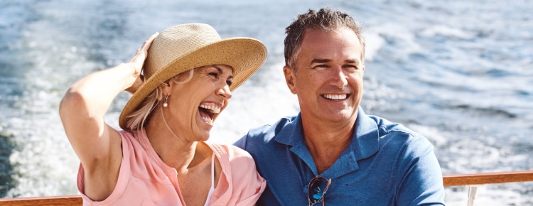 A couple on a yacht cruise.