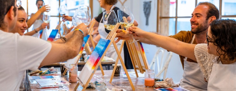 A group of people attending a painting workshop