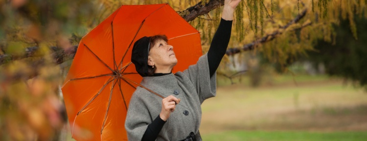 A woman under an umbrella.