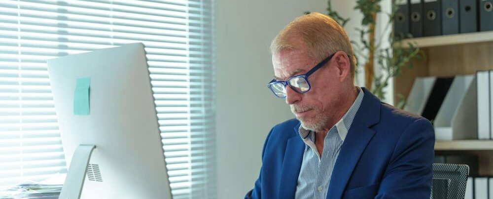A man working at an office desk.