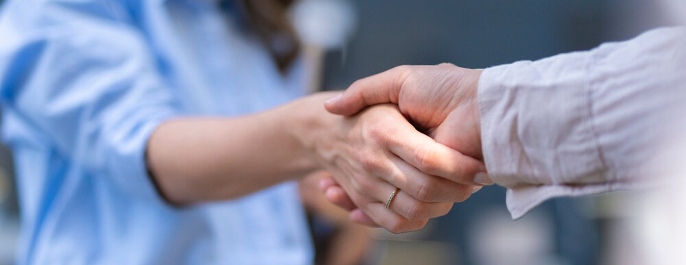 Two people shaking hands